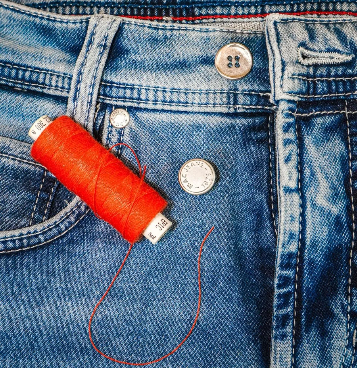 MAC reparation af knaphul service denim og stof